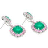 Cushion Green Emerald Sterling Silver Earrings with Sapphire Accents, featuring sparkling gemstones in an elegant design.